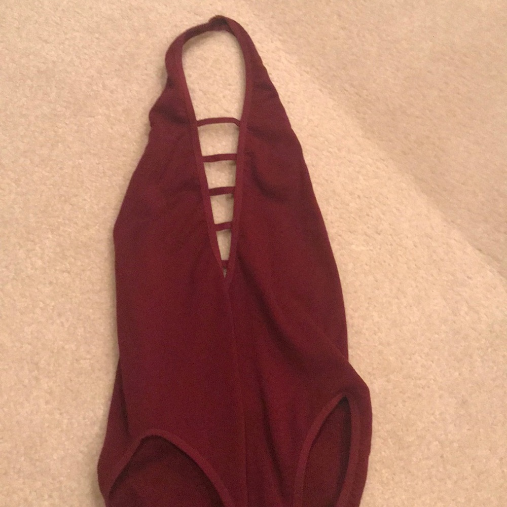 Darker red body suit
